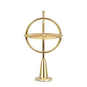 Gold self-balancing metal gyroscope on a pedestal base for STEM physics learning and desk decor