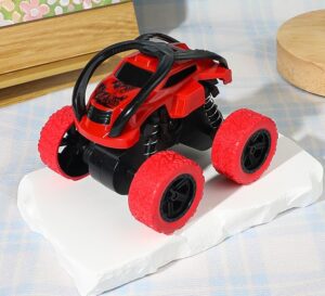 Red pull-back off-road stunt car toy with large knobby tires and shock absorbers