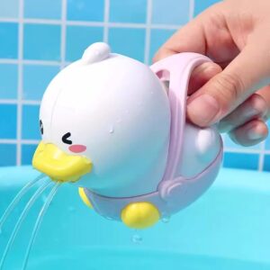 White cartoon sprinkling duck bath toy with water spray and pink handle for kids bathtub fun